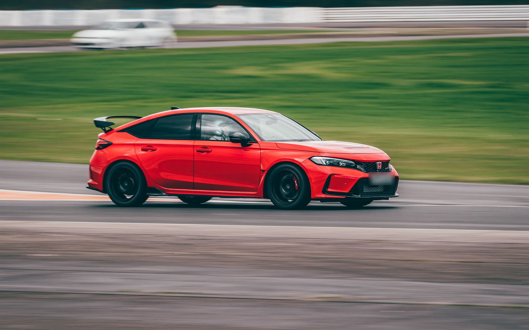 Red Honda Civic Type R FL5 at speed on the Blyton Park race track